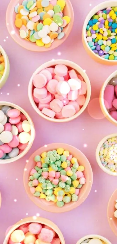 Colorful bowls of assorted candies with a pastel pink background.