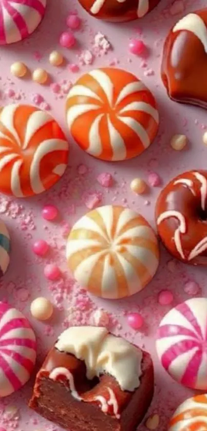 Vibrant candies and sweets on a pink background.