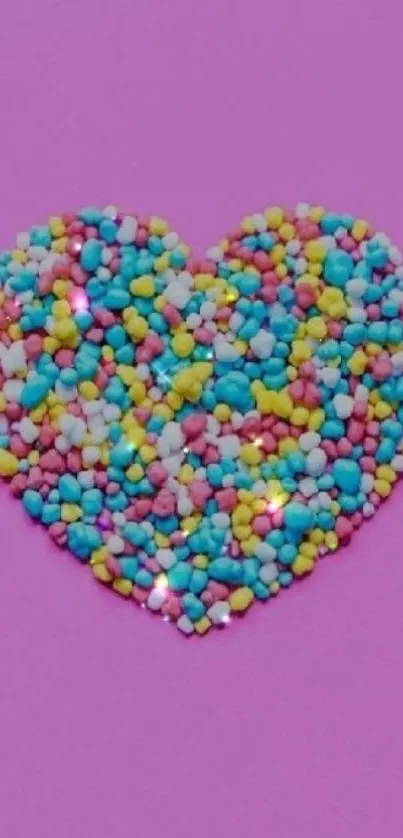 Colorful candy heart on a purple background wallpaper.