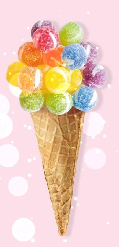 Colorful candy ice cream cone on pastel pink background.