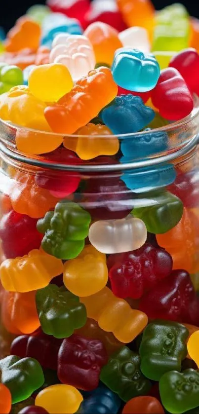 Multicolored gummy bear candies in a glass jar with vibrant colors.