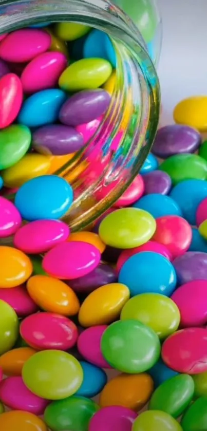 A colorful assortment of candies spilling from a glass jar.