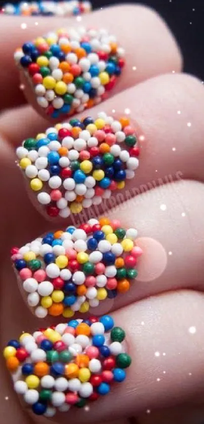 Colorful nail art with candy-like beads covering nails.