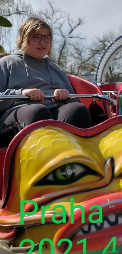 A colorful carnival ride in Prague with a dragon theme.