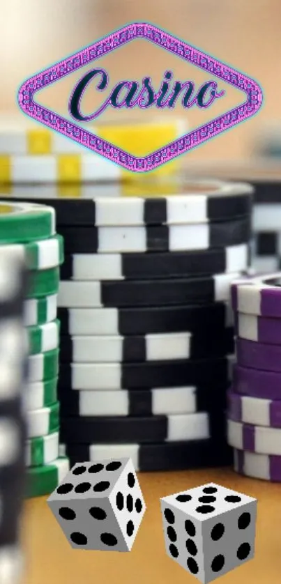 Colorful casino chips and dice on a table.