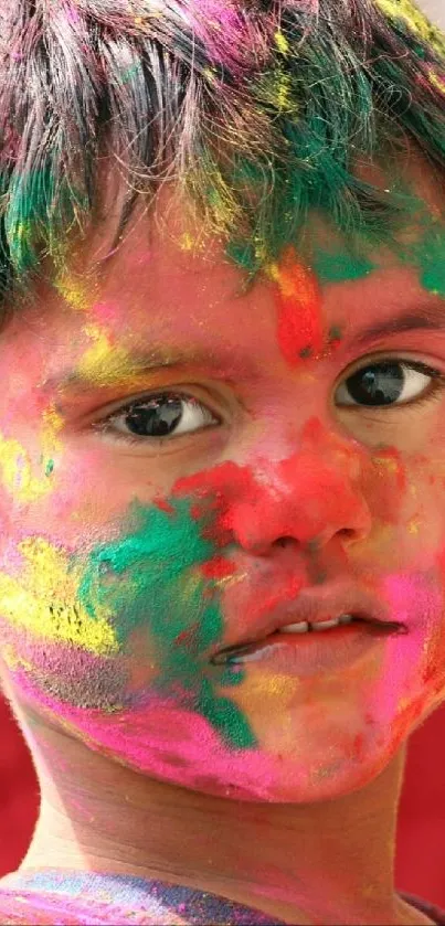 Child with colorful face paint during festival celebration.