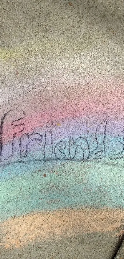 Chalk art of the word 'Friends' on a colorful concrete background.