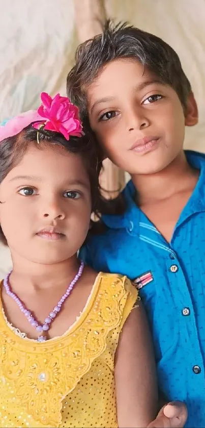 Brightly dressed children smiling joyfully.