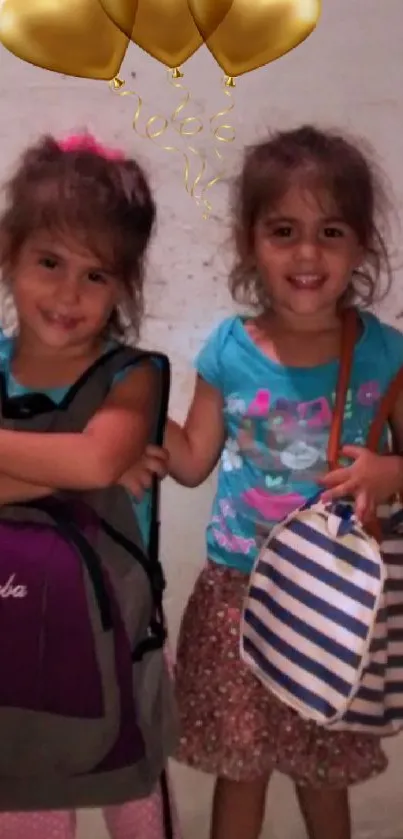 Two smiling children with colorful balloons and bags.