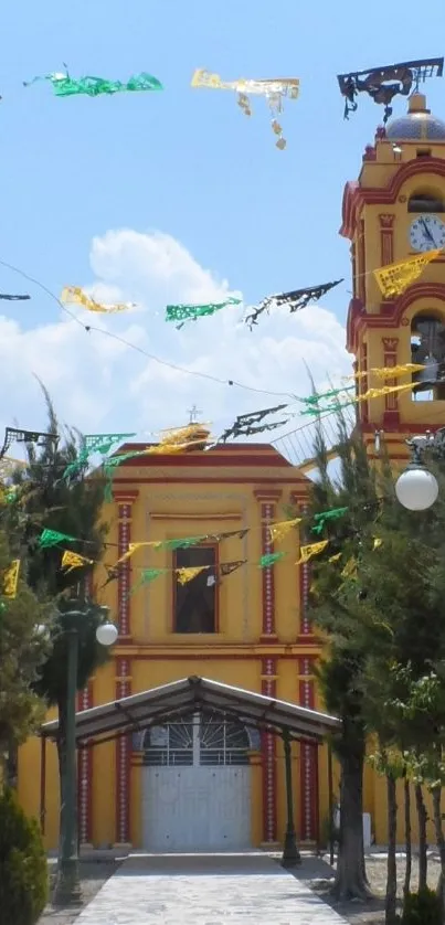 Vibrant church with colorful flags and a sunny sky.