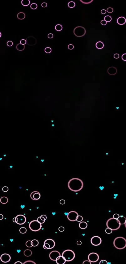 Mobile wallpaper with pink circles and blue hearts on a black background.