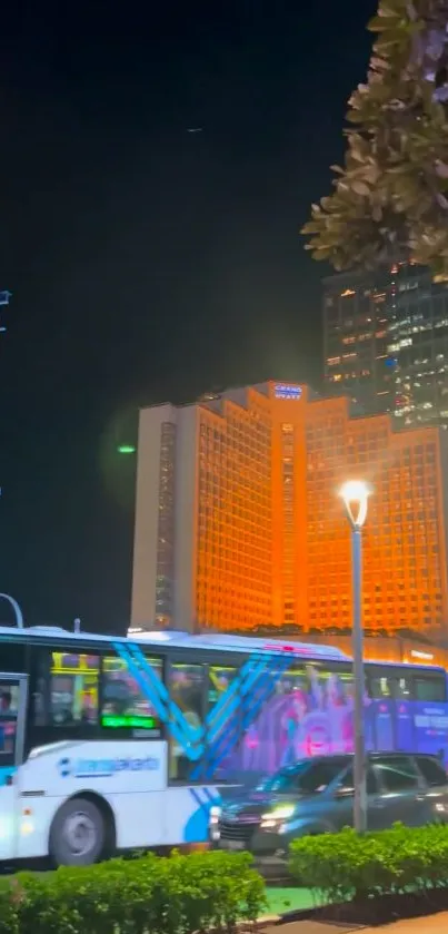 Colorful city nightscape with lit buildings and traffic.