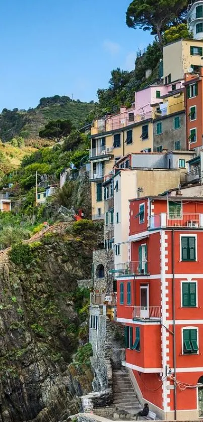 Colorful houses on a cliffside in Riomaggiore, Cinque Terre, Italy.