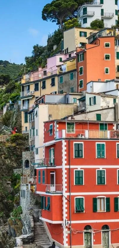 Colorful cliffside village with vibrant houses.