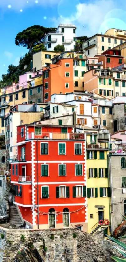 Colorful coastal village wallpaper with vivid cliffside houses and ocean.