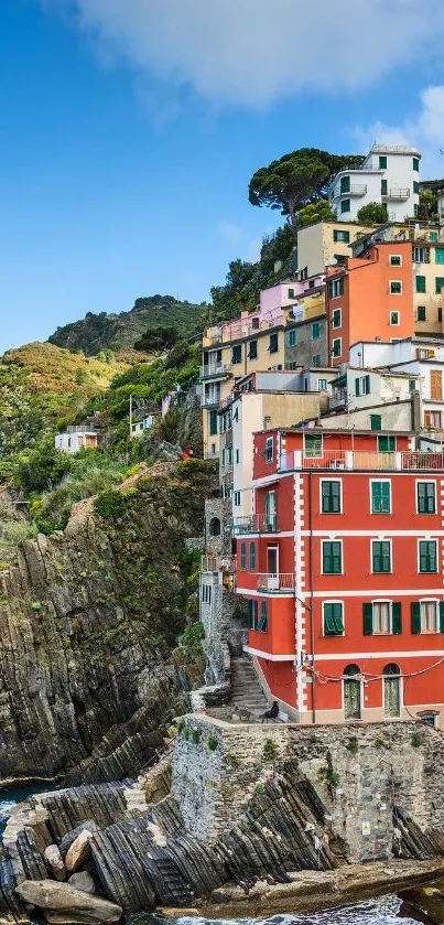 Colorful coastal village with cliffside homes and sea view.