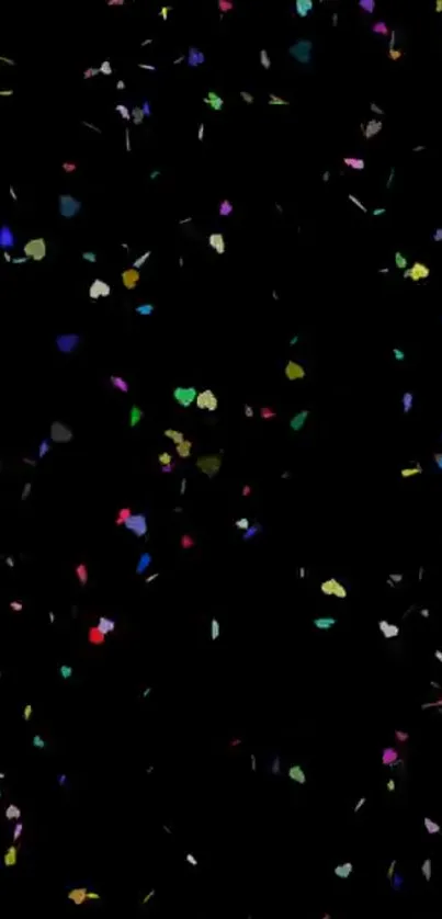 Colorful confetti scattered on a black background.