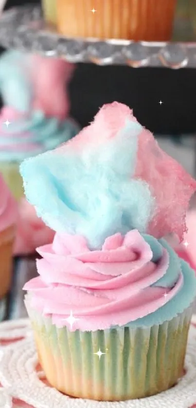 Colorful cotton candy cupcake with pink and blue frosting.