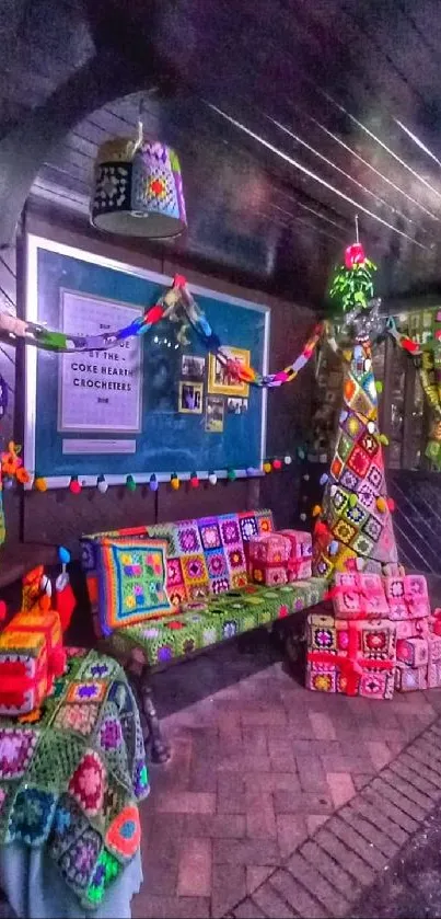 Colorful crochet tapestry and pillows at a cozy bus stop.