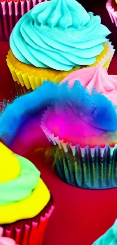 Colorful cupcakes with vibrant frosting on a red background.