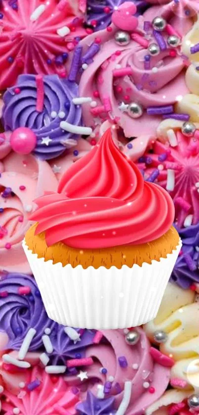 Colorful cupcake with vibrant swirls and sprinkles on a pink background.