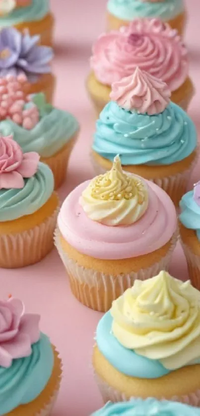 Colorful cupcakes with pastel icing on a pink background.