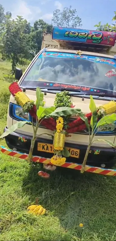 Decorated vehicle with floral garlands set in a lush green background.