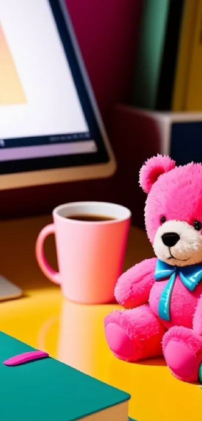 Vibrant pink desk setup with teddy bear.