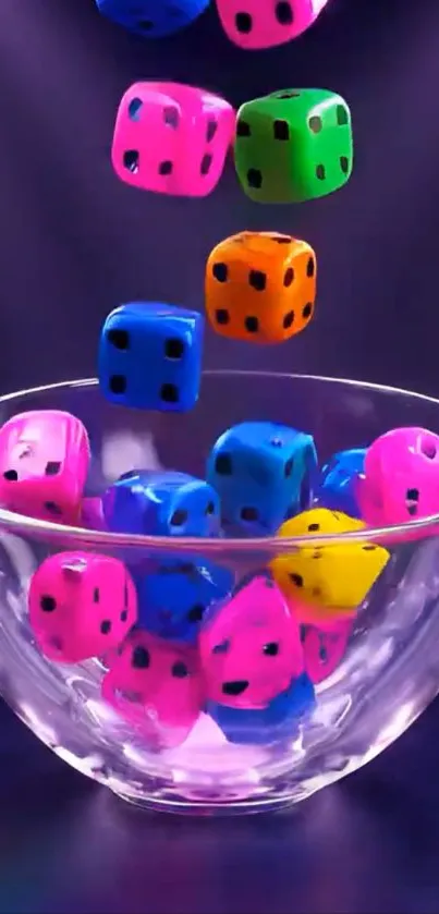 Colorful dice falling into a glass bowl on a purple background.
