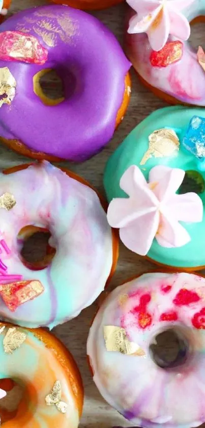 Assorted colorful donuts with vibrant decorations.