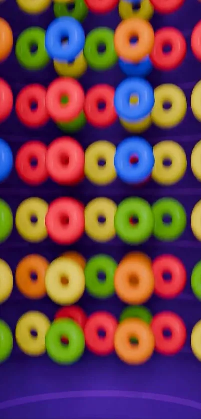 Colorful donuts on a purple background mobile wallpaper.