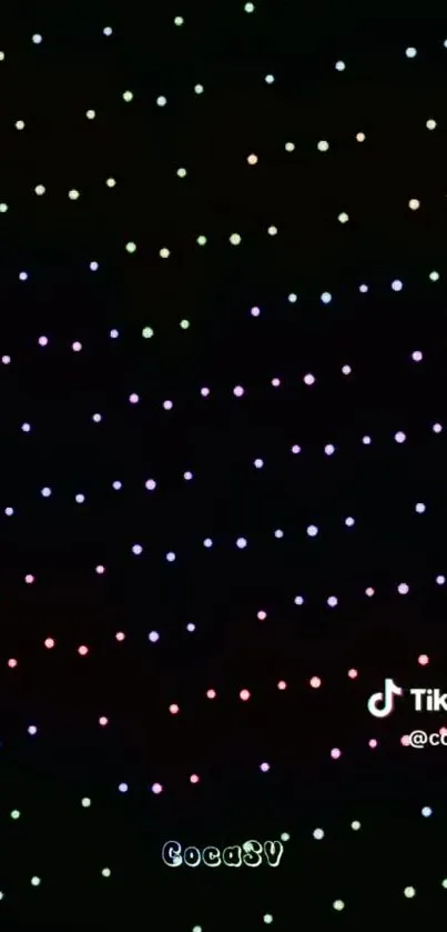 Mobile wallpaper with colorful dots on a black background.