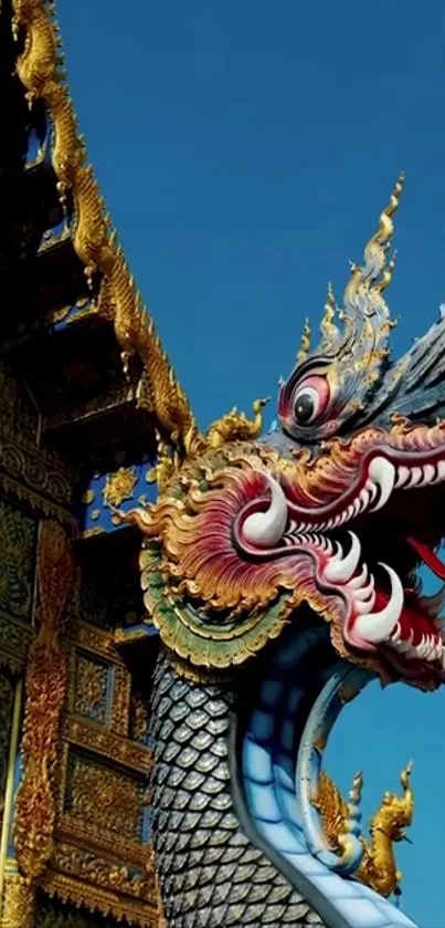 Vibrant dragon sculpture at colorful Asian temple.