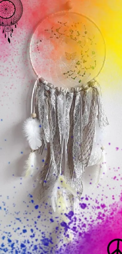Colorful dreamcatcher with pink, yellow, and blue splashes on a phone wallpaper.