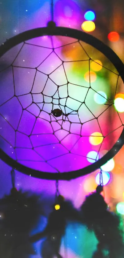 Vibrant dreamcatcher with colorful bokeh lights in the background.