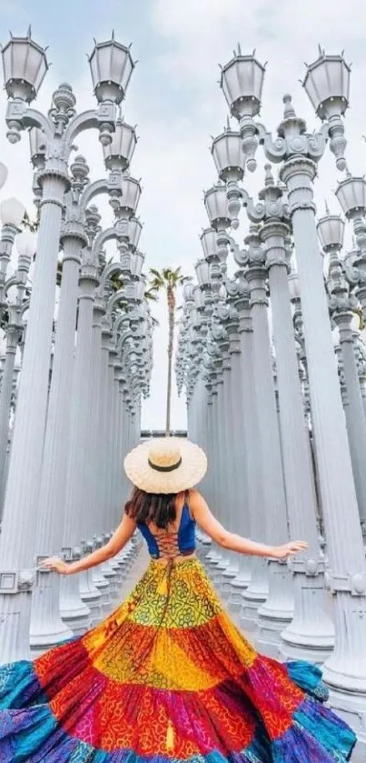 Woman in colorful dress among urban light poles.