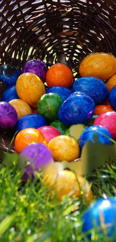 Vibrantly colored Easter eggs in a woven basket on grass.