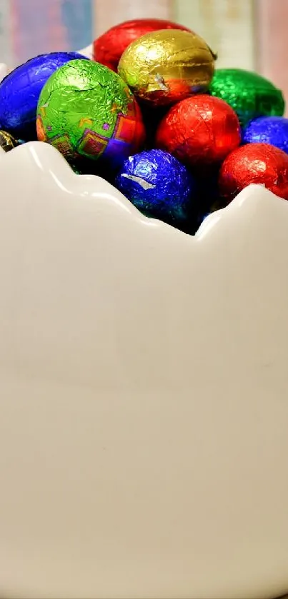 A white basket filled with colorful chocolate Easter eggs.