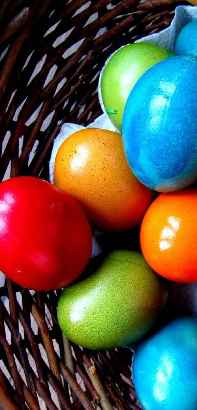 Colorful Easter eggs in a wicker basket on a dark background.