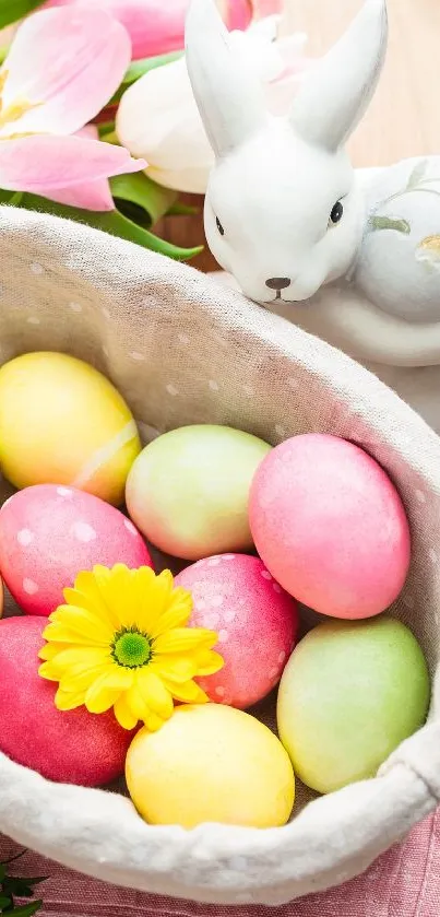 Basket of colorful Easter eggs with a yellow flower and bunny decoration.