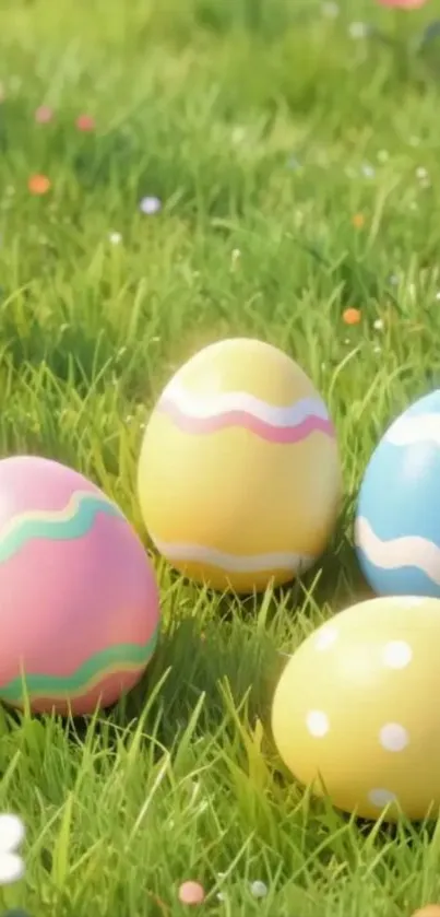 Vibrant Easter eggs on a grassy field background.