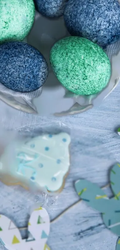 Colorful Easter eggs and spring decorations on a light blue textured surface.