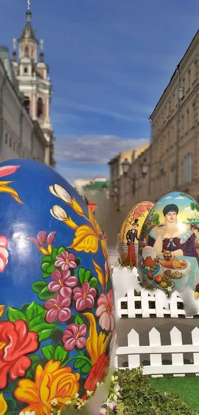 Colorful Easter eggs on a decorated city street with blue sky backdrop.