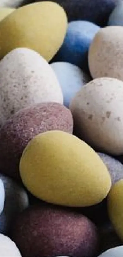 Colorful assorted egg-shaped stones wallpaper.