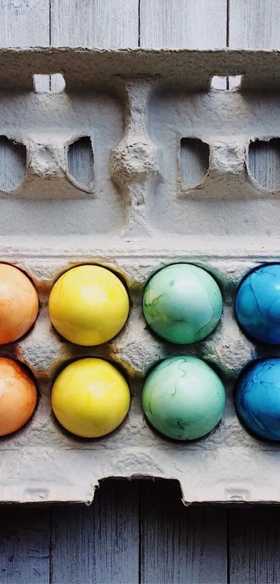 Mobile wallpaper with colorful eggs in a carton.