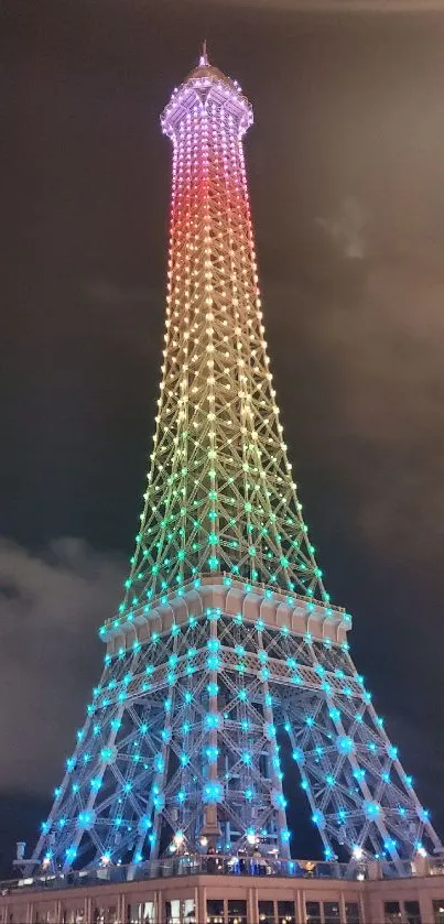 Colorful illuminated Eiffel Tower at night.