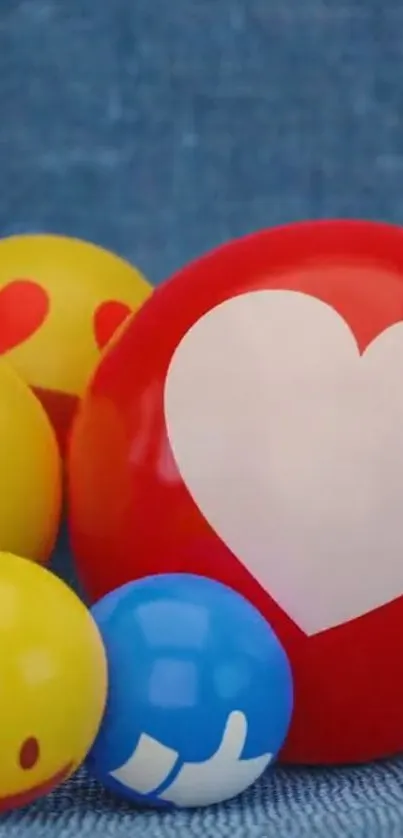 Colorful emoji balls with hearts on blue background.