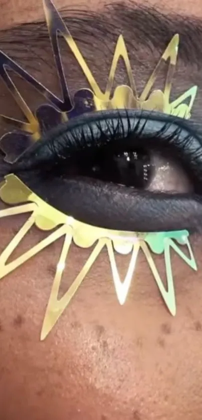 Close-up of an eye with colorful starburst makeup design.