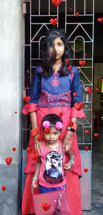 Family bonding scene with vibrant attire in a traditional home setting.