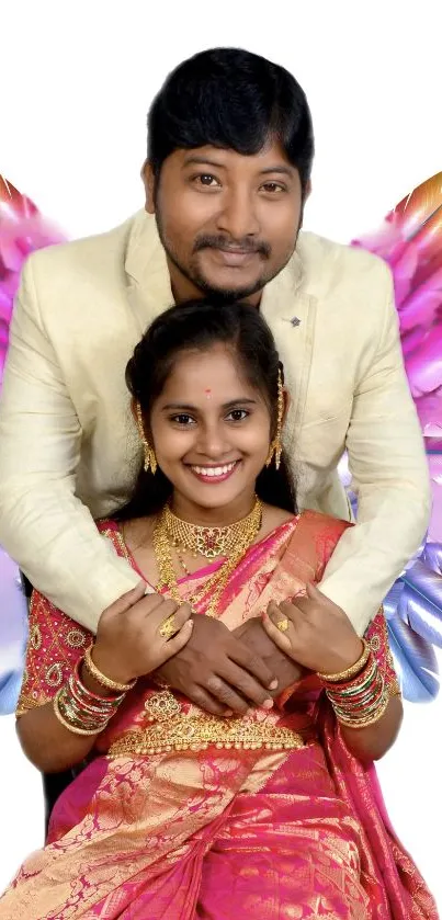 Smiling couple with colorful feathered wings on a vibrant background.